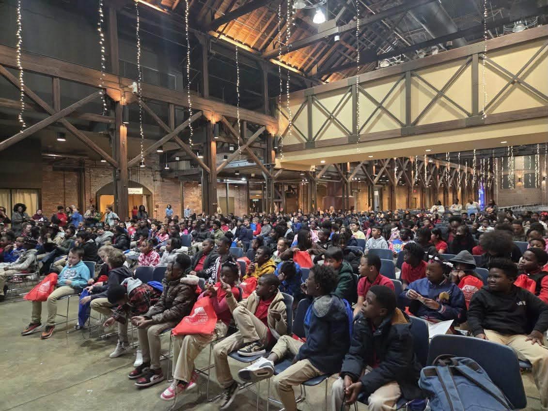 A large audience of students seated in an event hall