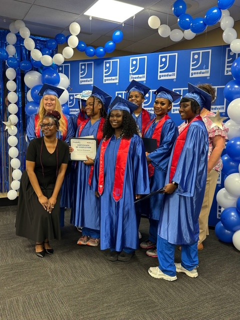 Goodwill BRIDGE graduates in caps and gowns